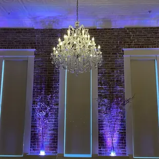 Beautiful uplighting and chandelier.