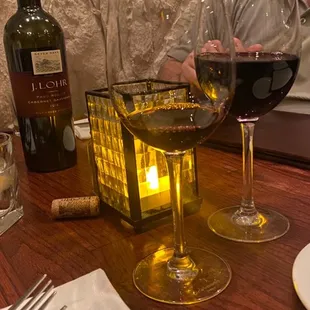 a glass of wine and a bottle of wine