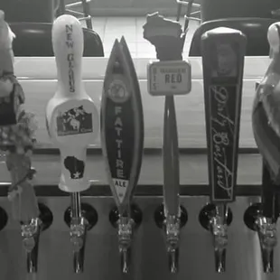 a row of beer taps