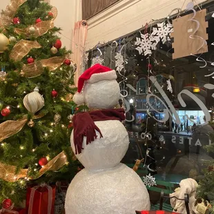 a snowman and christmas tree