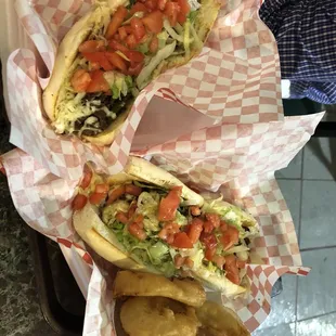 two hot dogs with toppings