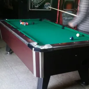 a man playing pool