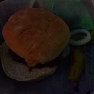a hamburger and pickles