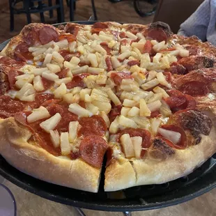 Pepperoni and pineapple pizza