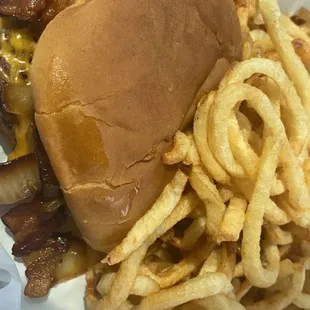 Bacon, cheese and grilled onions with curly fries.