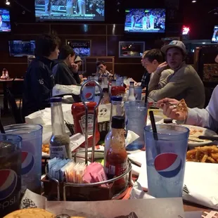 Dinner with my dad and all my kids! Grandson thinks he's big at the other end of the table... Lol