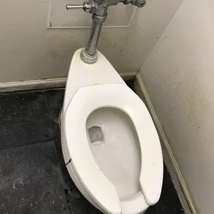 a toilet in a stall