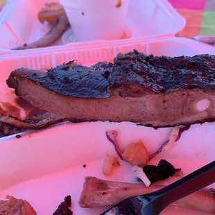 Smoke ring on the ribs. Can see the light pink quarter inch ring around the edges of the rib.