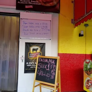 a sign in front of a restaurant