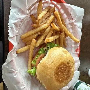 Cheese burger with fries and drink.