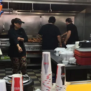 A bunch of chickens on the grill