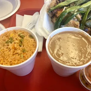 a plate of rice and a bowl of soup