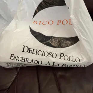 a plastic bag on a leather couch