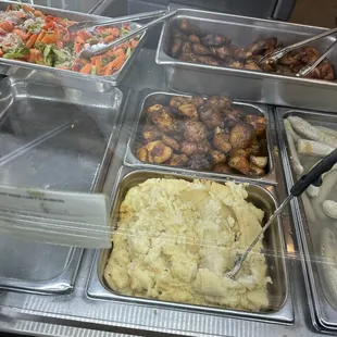 a variety of food items in a buffet