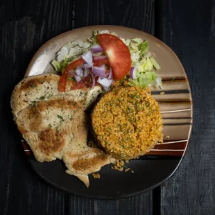 a plate of food on a wooden table