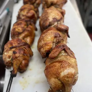 chicken skewers on a cutting board