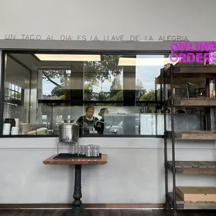 a woman behind the counter