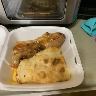 Oops! Took the picture late. This is one half the pepperoni calzone and one half of the combination calzone.