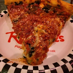 Slice of the deep dish pizza.