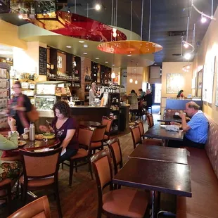 people sitting at tables in a restaurant