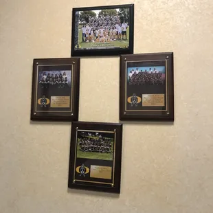 a group of framed pictures