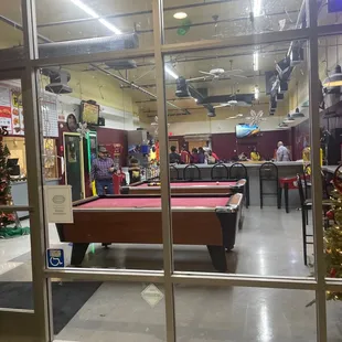 a pool table and a christmas tree