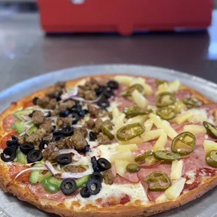 Thin Crust half Combo half Hawaiian with jalapeños