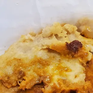 Pork and cheese pupusa more like Raw dough on the ends with what was left of the cheese that didn't spill on the grill.