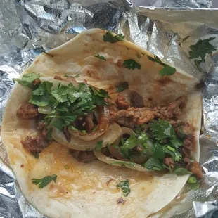 Steak taco with grilled onions and cilantro! Incredible.
