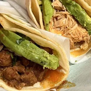 Chicken (top) and pork cheek (bottom) tacos.