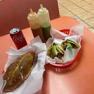 a sandwich and a drink on a table