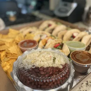 a variety of mexican food on a tray