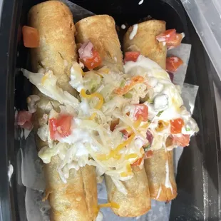 Beef flautas, 5$. Pretty tasty with the dressing on top.