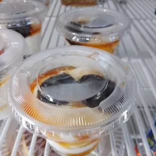 a variety of desserts in plastic containers