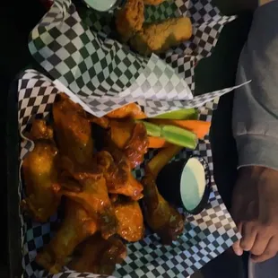 Hot wings &amp; chicken tenders Drinks are Pepsi &amp; the other is a Jack and Coke