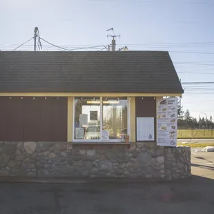 a small building with a sign on the front