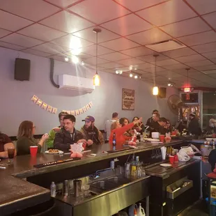 people sitting at the bar