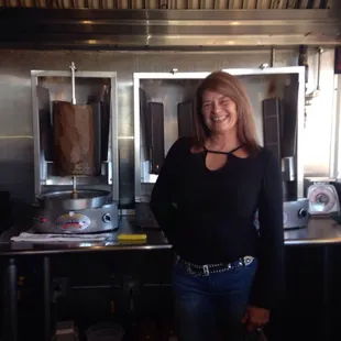 a woman standing in the kitchen