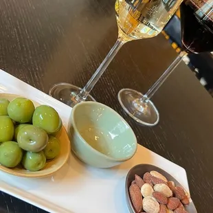 A glass of Moscato d'Asti, Syrah al a carte castelvetrano olives and almonds. That's how you take a shopping break.
