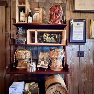 a shelf of wine barrels and other items