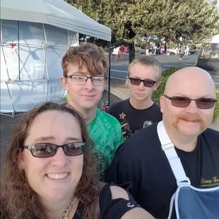 a group of people taking a selfie