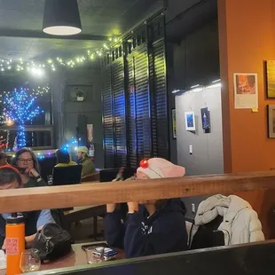 people sitting at a table in a restaurant