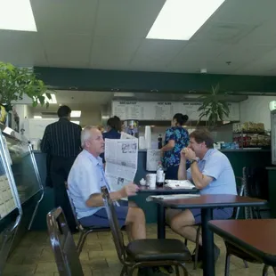 two men sitting at a table