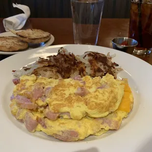 Ham and cheese omelette with hash browns and English muffin. Iced black tea.