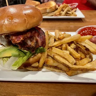 Avocado chicken club sandwich with hand cut fries. Weekly special.