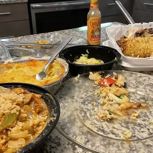 Chicken gumbo, Mac &amp; cheese, sweet potato cake, mixed veggies &amp; rice, corn on the cob, bbq half chicken, and rice and red beans.