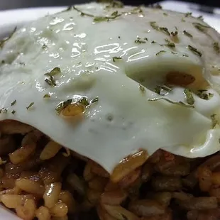 a plate of food with a fried egg