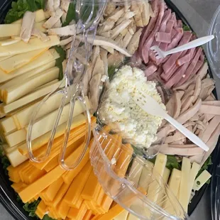 a variety of cheeses and meats