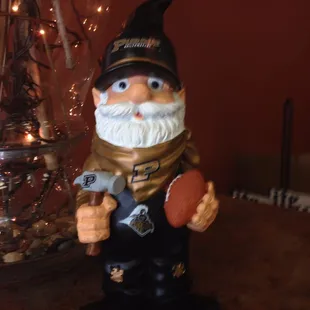 a gnome holding a football