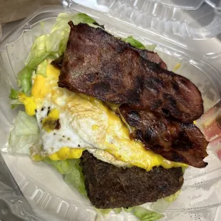 Turkey, bacon and egg with extra egg, cheese snd scrapple on a bed of lettuce! Amazing!!!